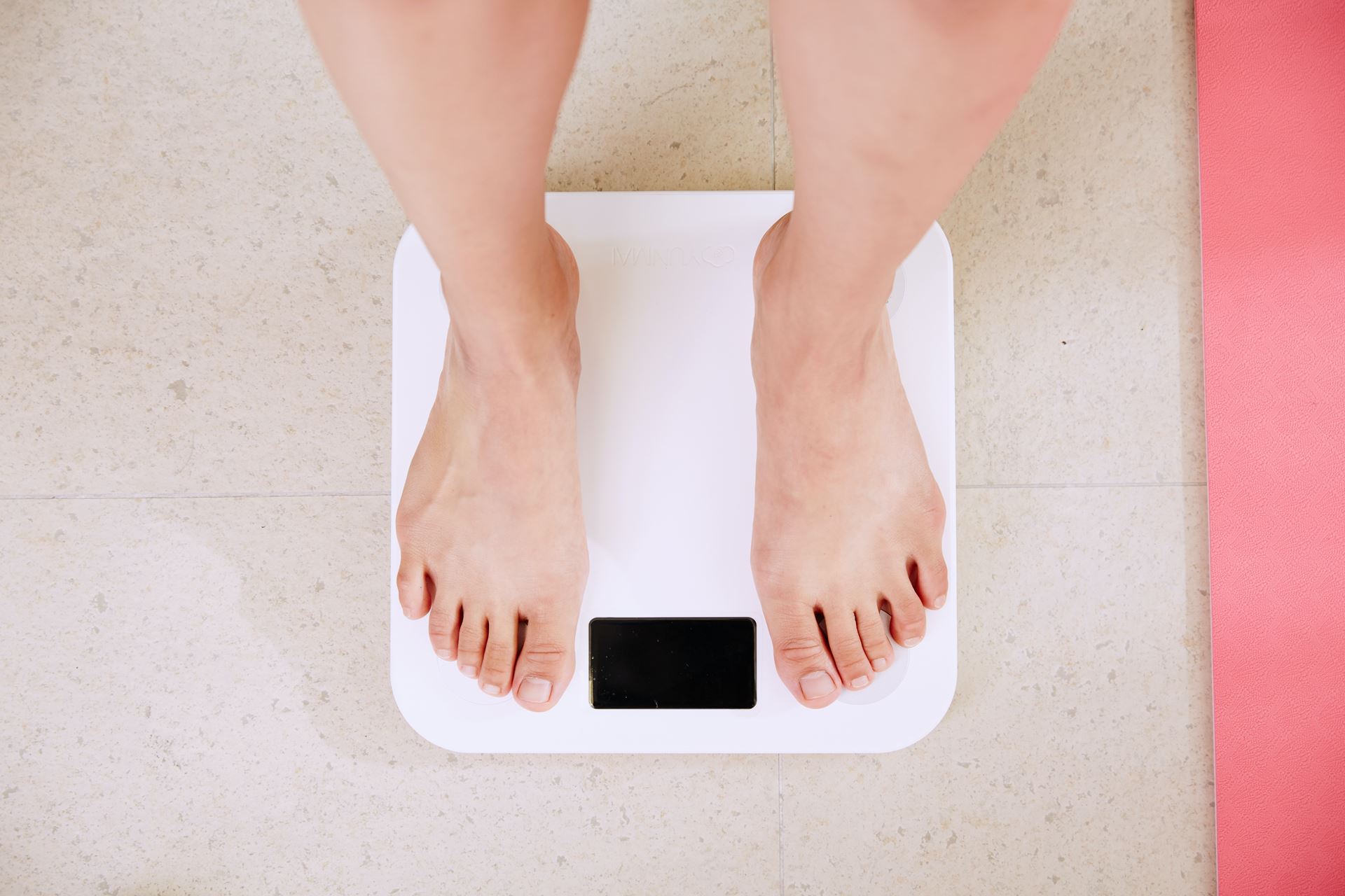 Patient standing on scales